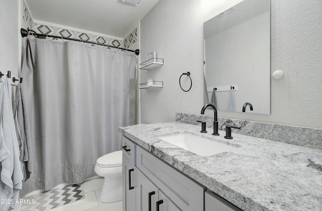 full bathroom featuring toilet, vanity, a shower with curtain, and a textured wall