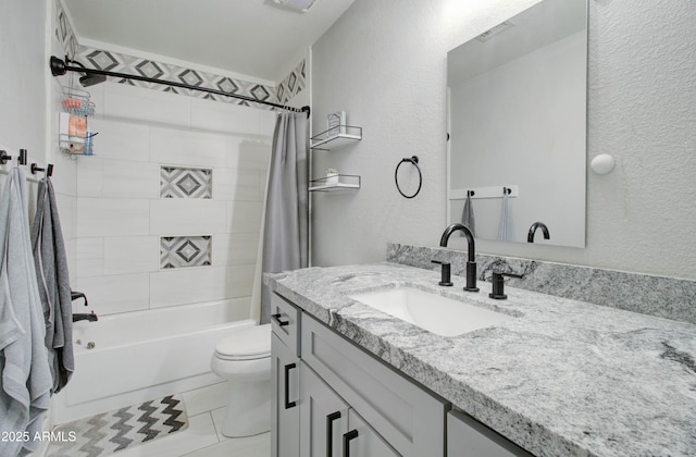 bathroom with toilet, shower / bath combo with shower curtain, a textured wall, tile patterned floors, and vanity