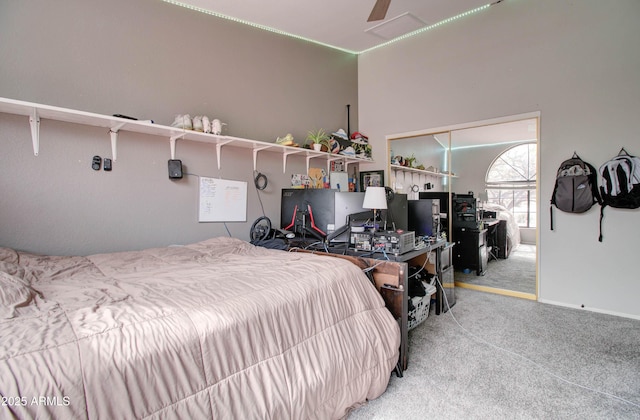 bedroom featuring baseboards, carpet floors, and ceiling fan