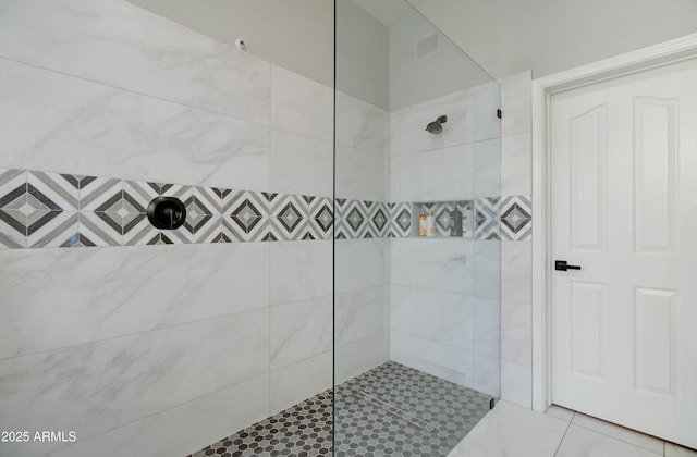 full bath featuring tiled shower