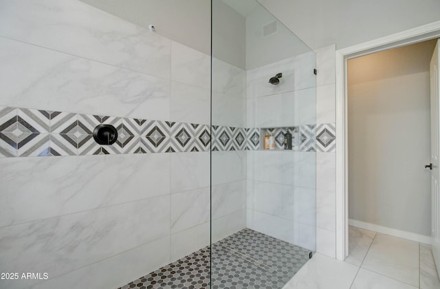 full bath with a tile shower