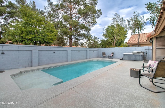 view of swimming pool featuring a patio area, a fenced in pool, and a fenced backyard