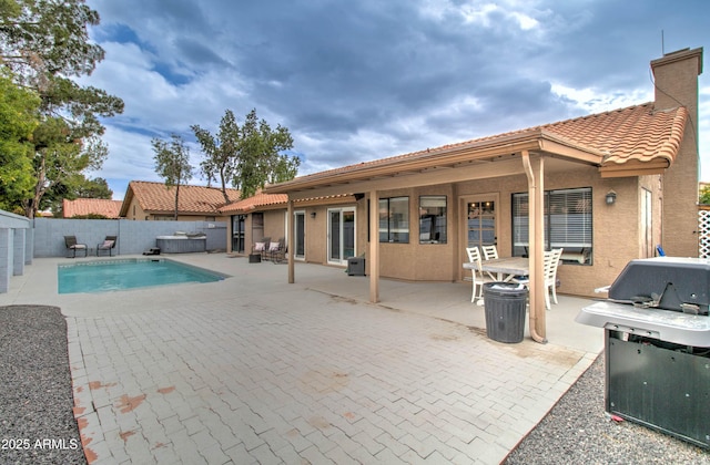 view of pool with a fenced in pool, a grill, a fenced backyard, and a patio area