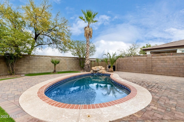 view of swimming pool featuring a patio