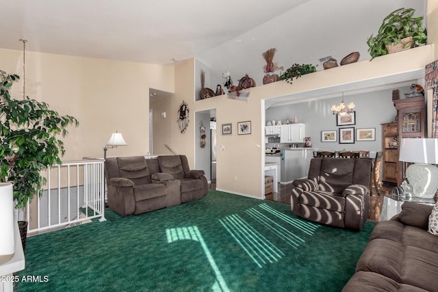 carpeted living room featuring high vaulted ceiling and a chandelier