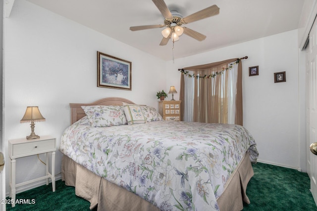 bedroom with ceiling fan, dark colored carpet, a closet, and baseboards