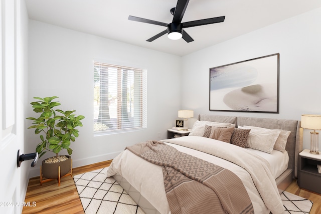 bedroom with light hardwood / wood-style flooring and ceiling fan