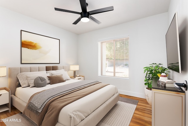 bedroom featuring ceiling fan and light hardwood / wood-style flooring