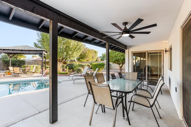 view of patio / terrace with ceiling fan, a gazebo, and a fenced in pool