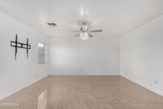 spare room with ceiling fan