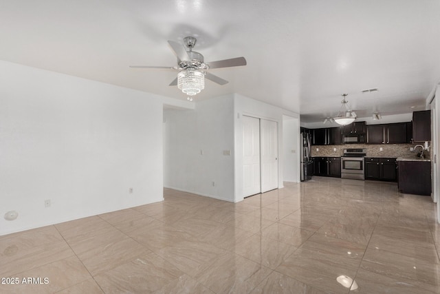 unfurnished living room with sink and ceiling fan