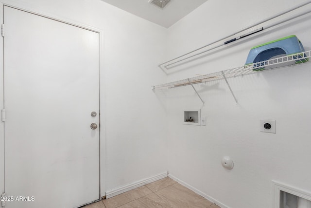 washroom featuring hookup for a washing machine, gas dryer hookup, hookup for an electric dryer, and light tile patterned floors