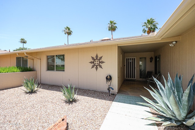 doorway to property featuring a patio area