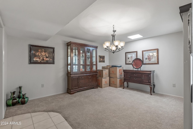 living area featuring a chandelier and light colored carpet