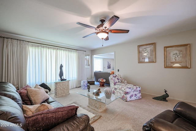 living room with carpet floors and ceiling fan