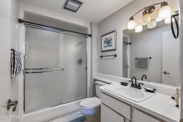 bathroom featuring a shower with door, toilet, tile patterned floors, and vanity