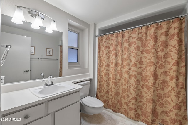 bathroom featuring vanity, toilet, and tile patterned floors