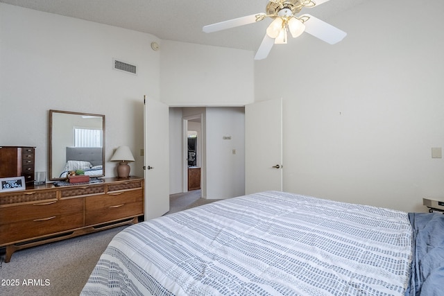 bedroom with high vaulted ceiling, ceiling fan, and carpet flooring