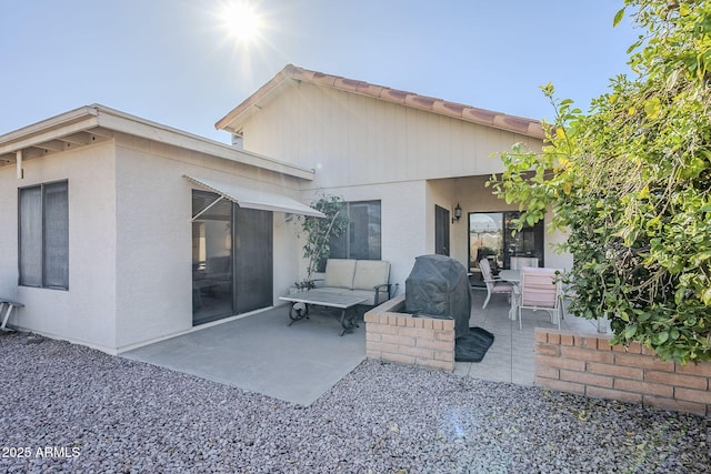 back of property with a patio