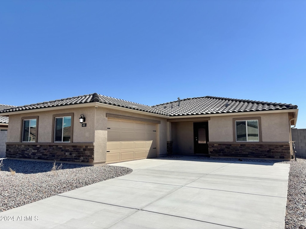 view of front of property with a garage