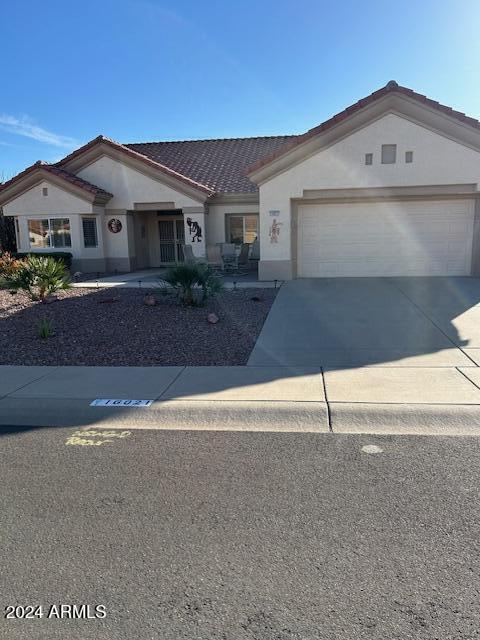 ranch-style home with a garage