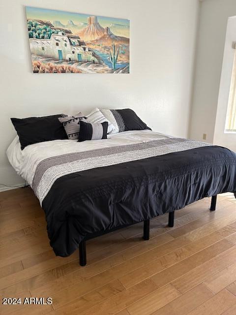 bedroom featuring wood-type flooring