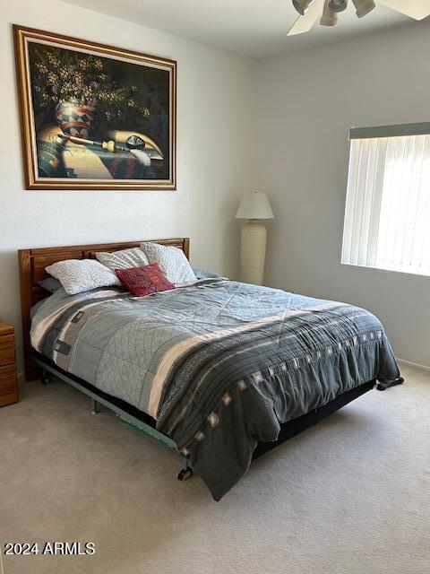 bedroom with carpet flooring and ceiling fan