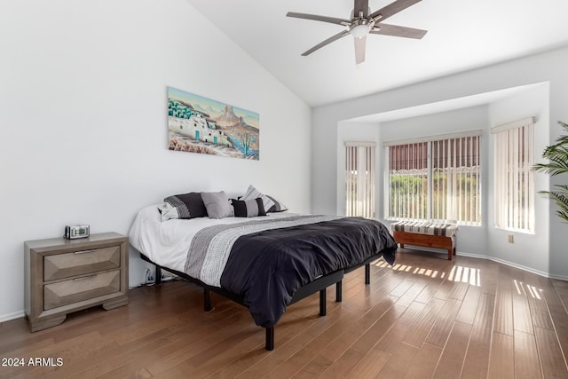 bedroom featuring ceiling fan, hardwood / wood-style floors, and high vaulted ceiling