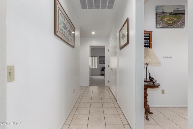 hall with light tile patterned flooring