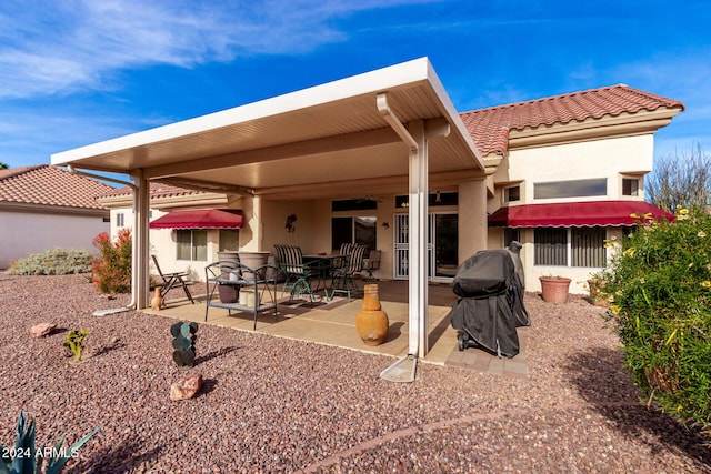 back of house with a patio area