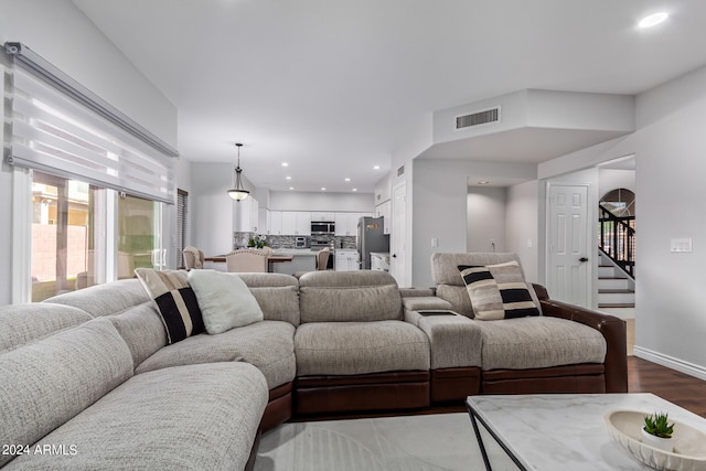 living room with dark wood-type flooring