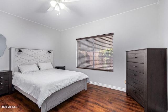 bedroom featuring ceiling fan and dark hardwood / wood-style floors