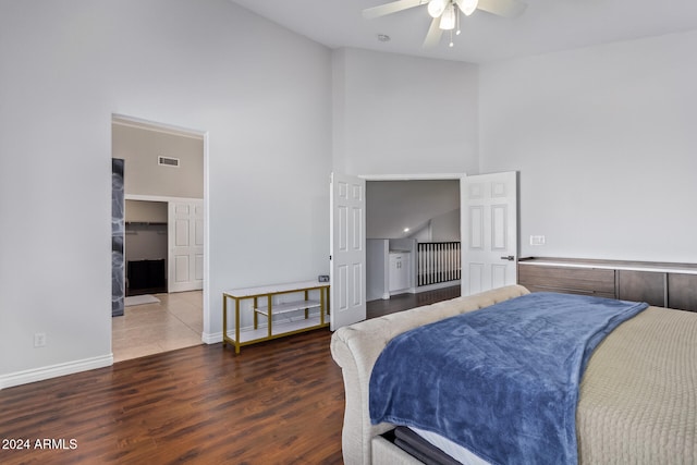 bedroom with high vaulted ceiling, ceiling fan, and dark hardwood / wood-style floors