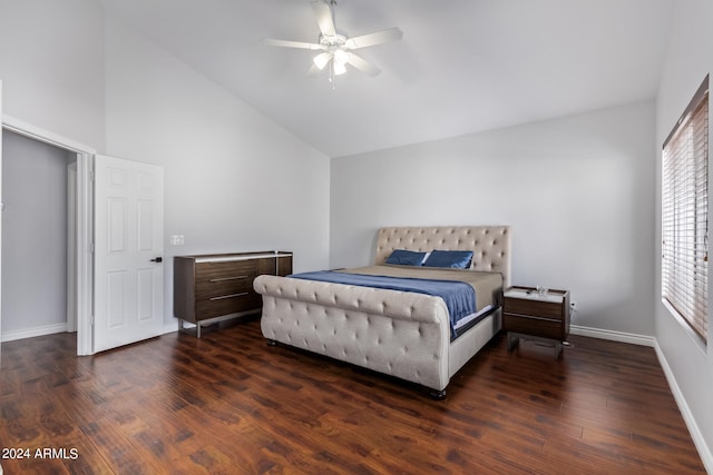 bedroom featuring ceiling fan, dark wood-type flooring, and vaulted ceiling