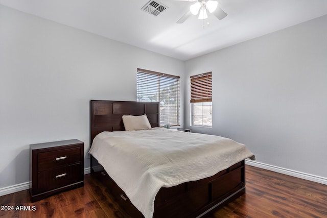 bedroom with dark wood-type flooring and ceiling fan