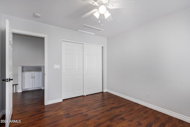 unfurnished bedroom featuring ceiling fan, a closet, and dark hardwood / wood-style flooring