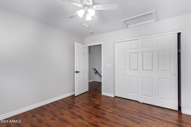 unfurnished bedroom with ceiling fan, a closet, and dark hardwood / wood-style flooring