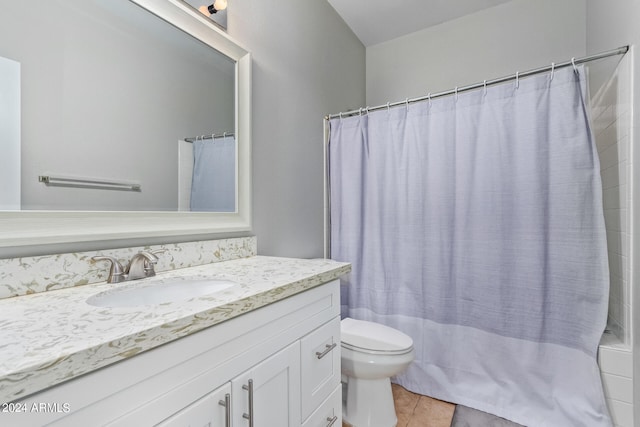 bathroom with tile patterned floors, vanity, and toilet