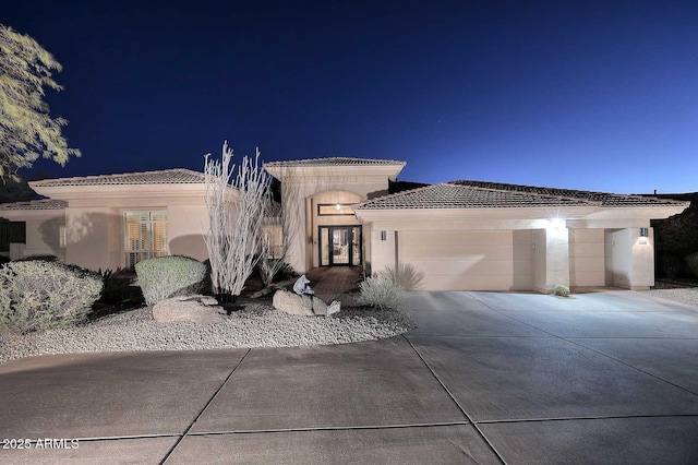 view of front of home with a garage