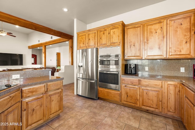kitchen featuring decorative backsplash, appliances with stainless steel finishes, ceiling fan, tile countertops, and light tile patterned floors