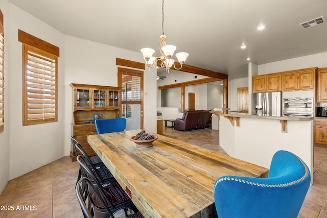 dining space featuring recessed lighting, visible vents, light tile patterned floors, and an inviting chandelier