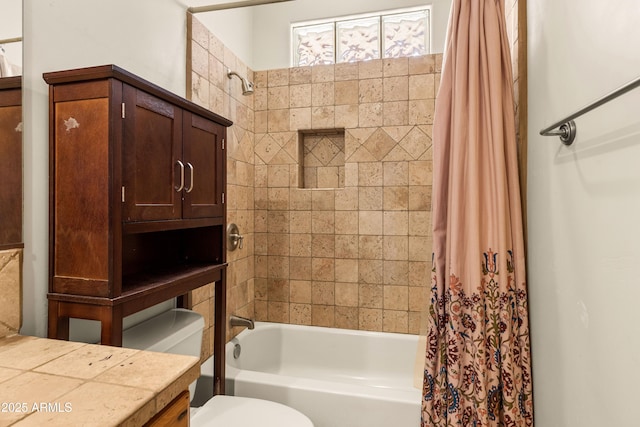 full bath with shower / bath combo, vanity, and toilet