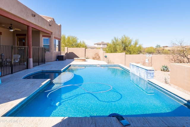 view of pool with a fenced in pool, a patio area, a fenced backyard, and a ceiling fan