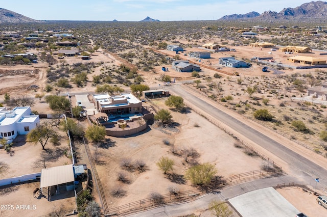 birds eye view of property with a rural view, a desert view, and a mountain view