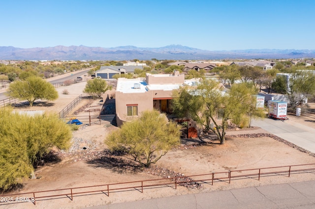 birds eye view of property featuring a mountain view
