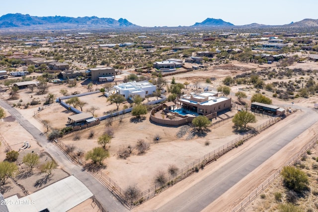 bird's eye view with view of desert and a mountain view