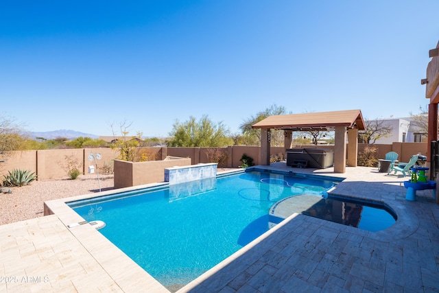 view of swimming pool featuring a patio area, a fenced backyard, a fenced in pool, and a hot tub