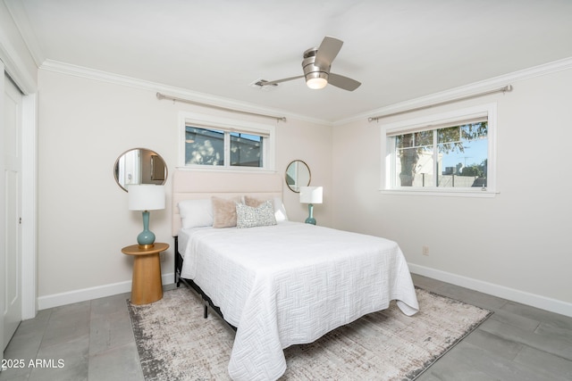 bedroom with ceiling fan and crown molding