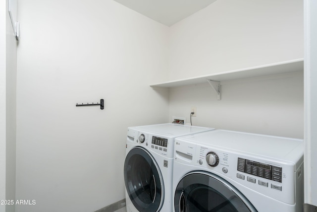 laundry area with independent washer and dryer