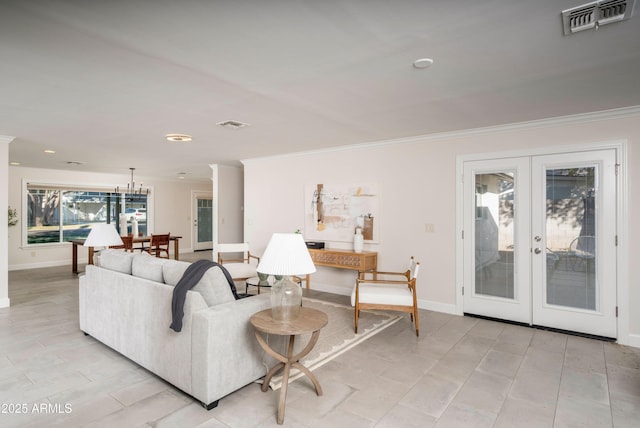 living room with french doors and crown molding